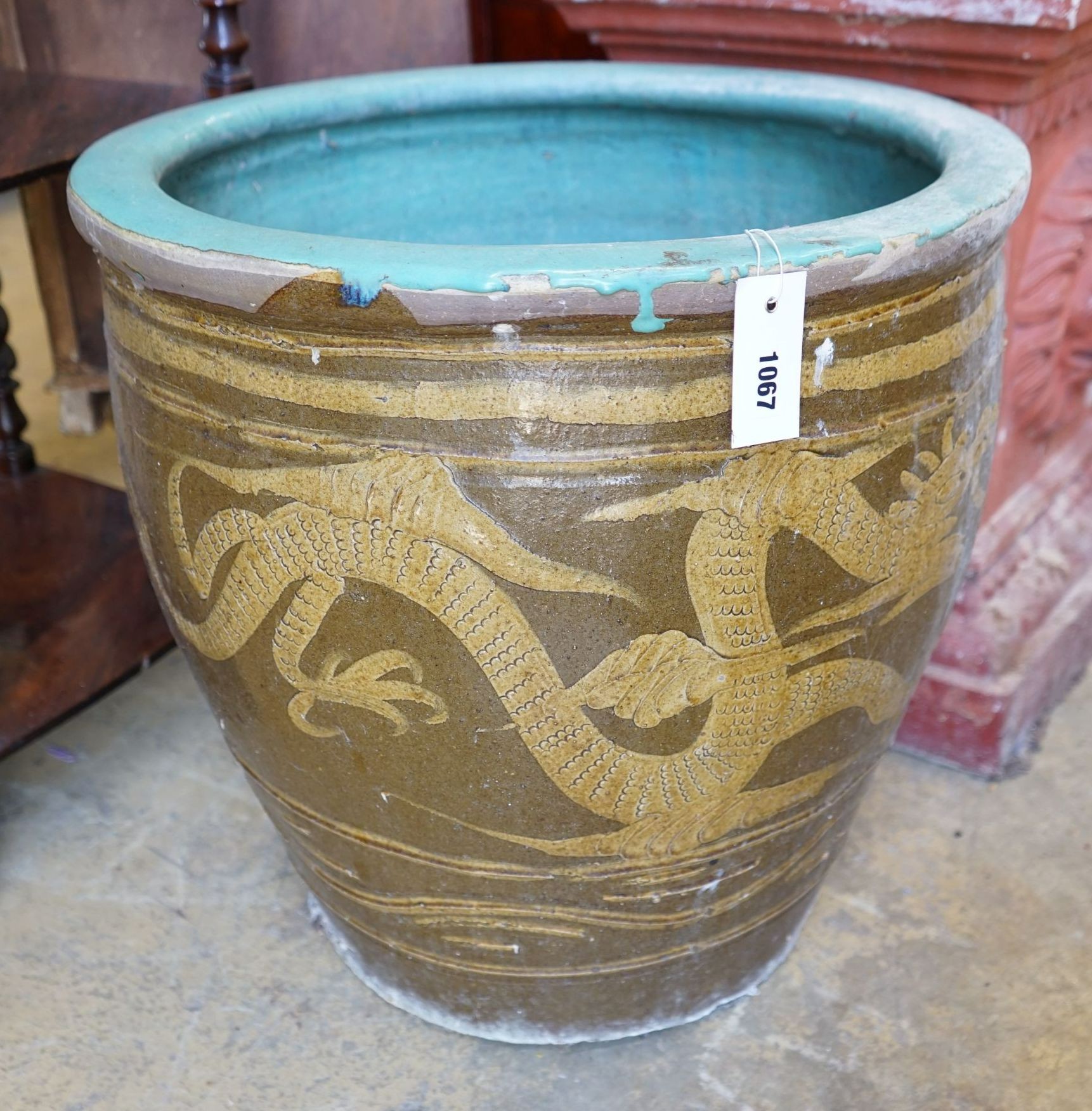 A circular Chinese style glazed earthenware garden planter, diameter 50cm height 50cm.